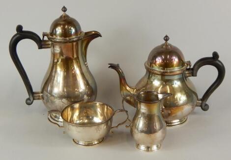 A George VI silver four piece tea set in 18thC style