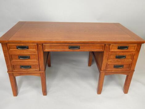 An oak twin pedestal desk