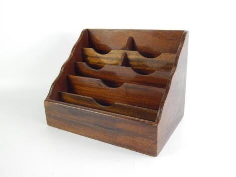 An early 20thC mahogany stepped stationery rack