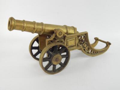 A brass table cannon