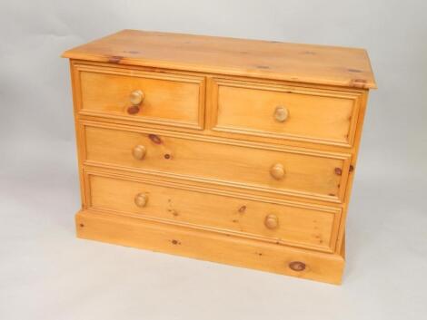 A pine chest of drawers