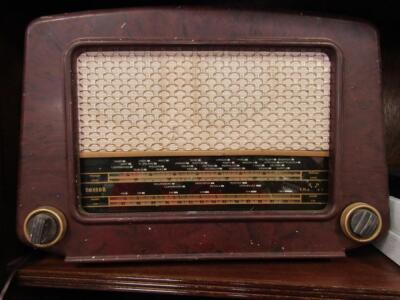 A Cossor brown Bakelite radio.