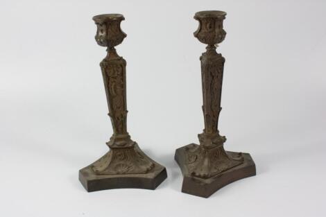 A pair of late 19thC Continental bronze candlesticks