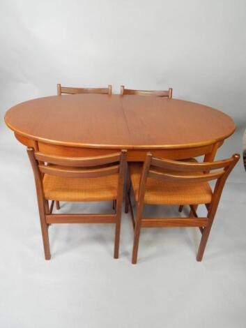 A 1960's teak oval extending dining table