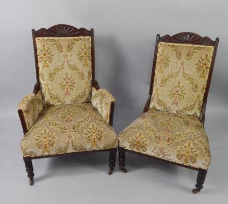 A pair of Victorian mahogany gentleman's and lady's armchairs