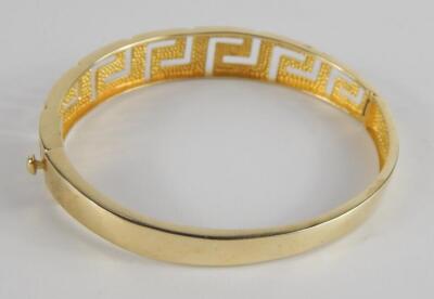 A yellow metal bangle in an open work Greek Key design - 3