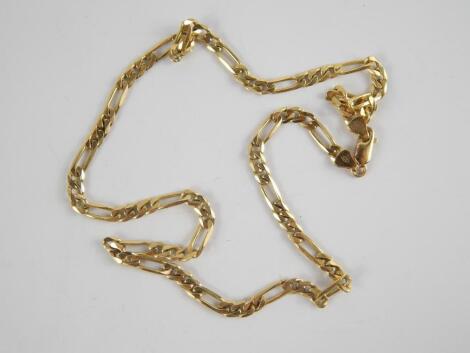 A yellow metal curb link neck chain