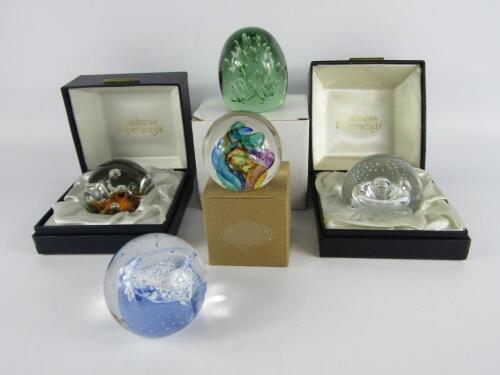 Two Caithness glass paperweights modelled as star watch and sea dance