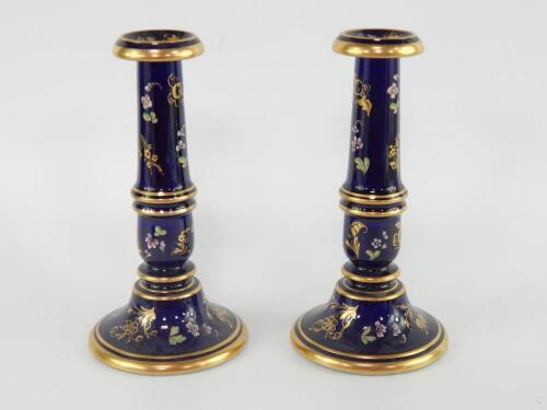 A pair of mid 19thC pottery candlesticks