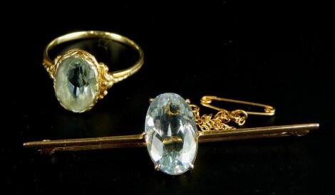 An aquamarine set dress ring and an aquamarine set bar brooch