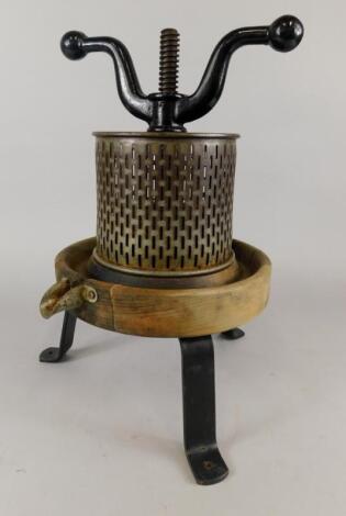 An unusual late 19thC iron and tin fruit press