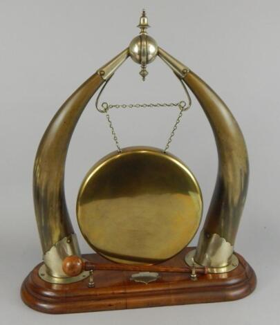 A late 19th/early 20thC oak and brass dinner gong