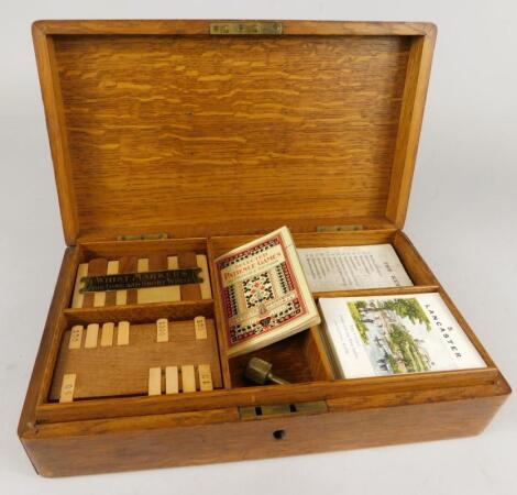 An oak box containing a number of playing card related items