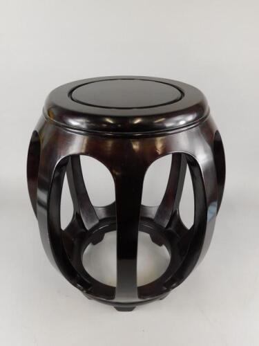 A 20thC oriental hardwood barrel shaped urn stand or seat