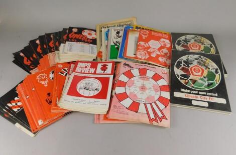 A quantity of Lincoln City Football programmes