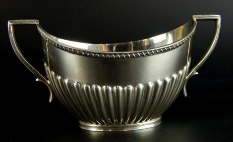 A silver two handled oval sugar bowl