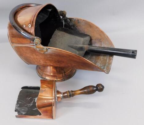 A late Victorian copper helmet shaped coal scuttle