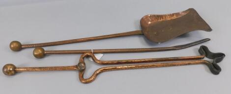 A set of Arts and Crafts style Newlyn type hammered copper fire irons