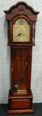 A reproduction stained beech Grandfather clock