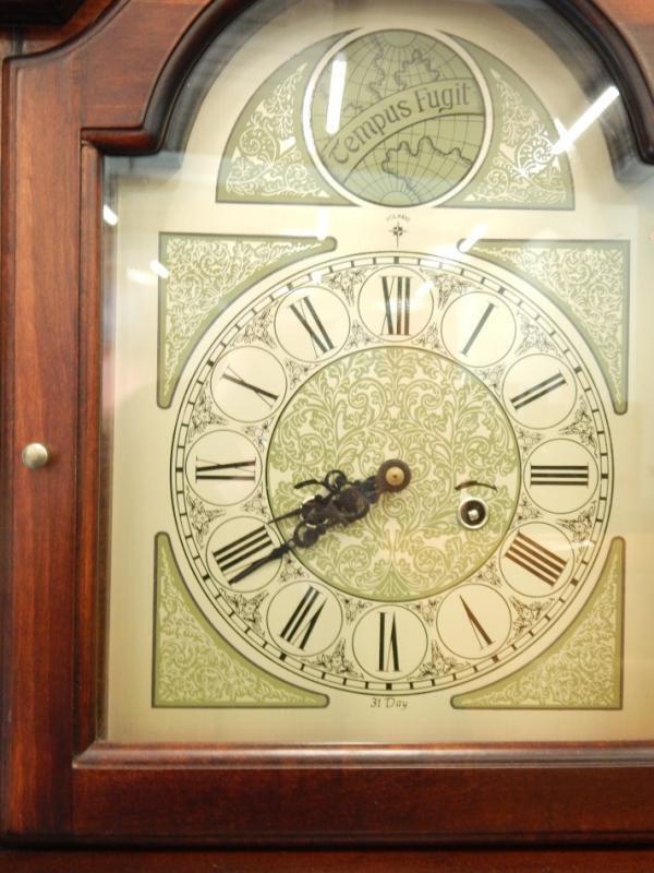 A reproduction stained beech Grandfather clock