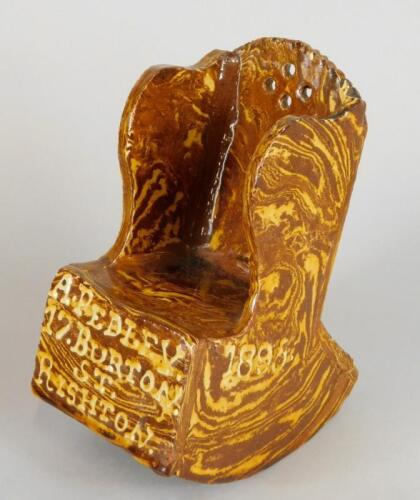 A late 19thC agateware pottery model of a country rocking chair