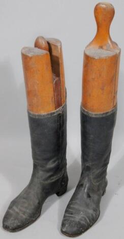 A pair of black leather hunting boots