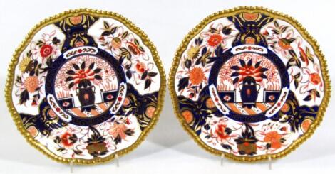 A near matching pair of 20thC Spode Imari pattern plates