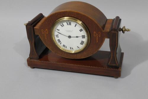 An Edwardian mahogany and boxwood strung mantel clock