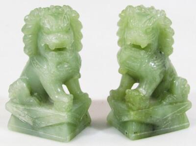 A pair of 20thC Chinese jadeite figures of Dogs of Fo