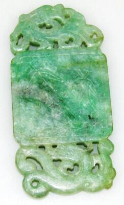 A Chinese tri-colour carved jade pendant