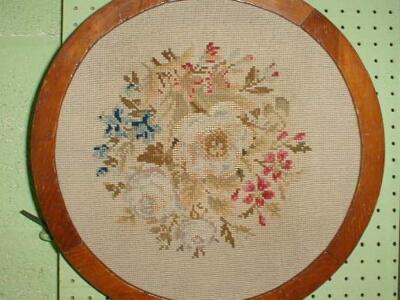 A Victorian woolwork floral panel