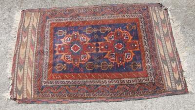 A 20thC woollen rug