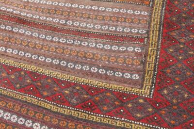 A 20thC woollen rug - 2