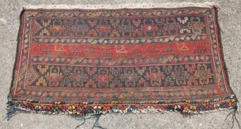 A Middle Eastern woollen rug