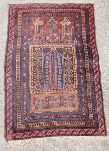 A 20thC Middle Eastern woollen rug