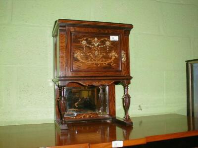 An Edwardian rosewood table cabinet with single door having floral marquetry