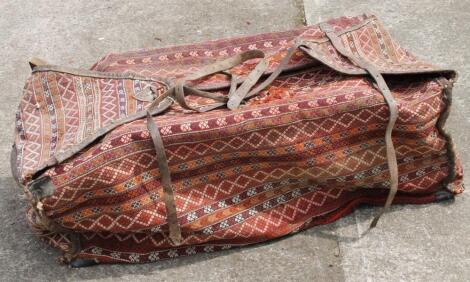 A 20thC embroidered saddle