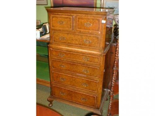 A Queen Anne style walnut tallboy with a burr quarter veneered top with