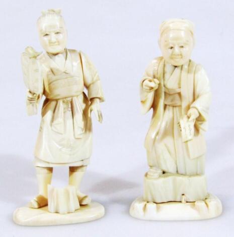 A pair of late 19thC Japanese ivory okimono figures