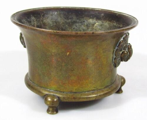 A Chinese bronze tripod incense burner