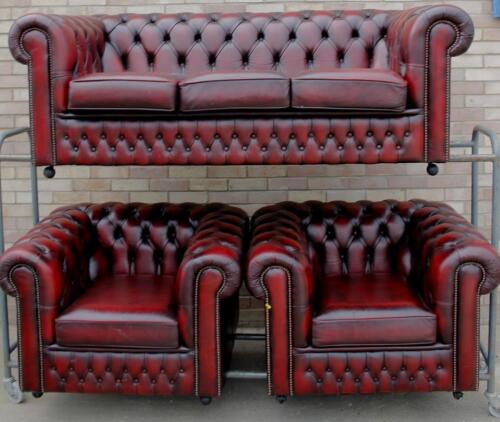 A maroon leather three seat Chesterfield sofa