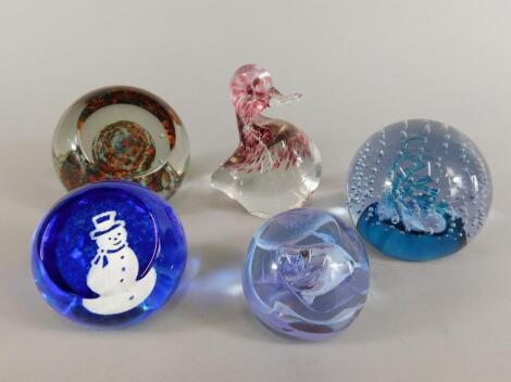 A collection of five paperweights