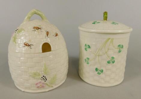 Two Belleek jars and covers