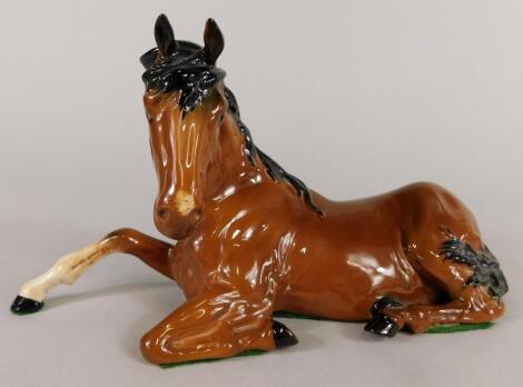 A Beswick model of a seated horse