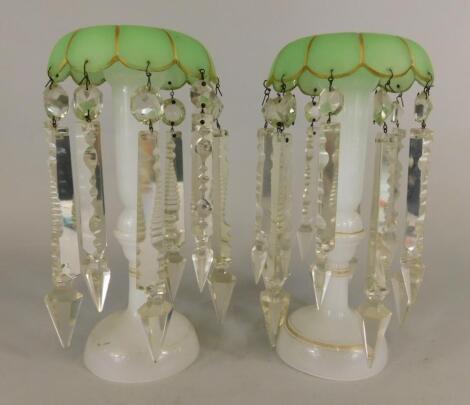 A pair of late 19thC green frosted and opaque glass table lustres