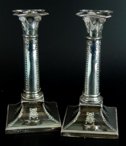 A pair of Edwardian silver candlesticks