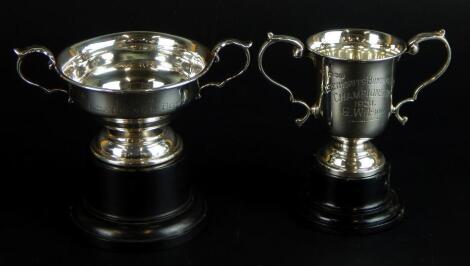 Two silver two handled cups