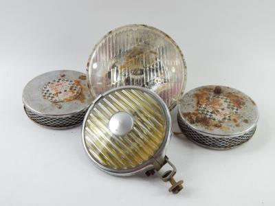 Five Lucas car head lamps.