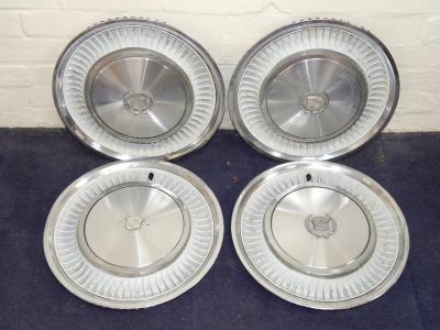 A set of Cadillac hub caps.