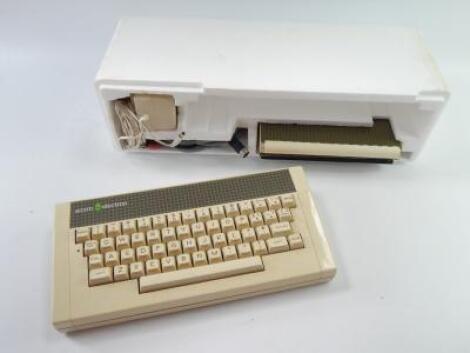 An Acorn Electron computer and manuals